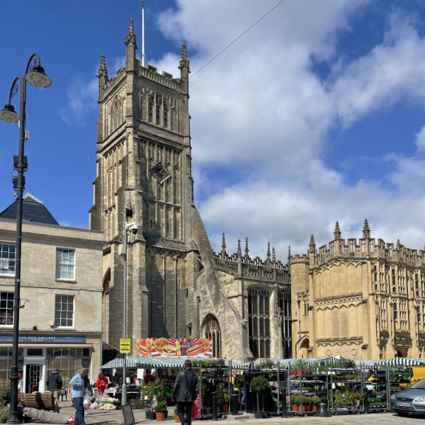 Cirencester Market against a backdrop of the Church of St. John the Baptist<br>Photo copyright Cirencester.co.uk